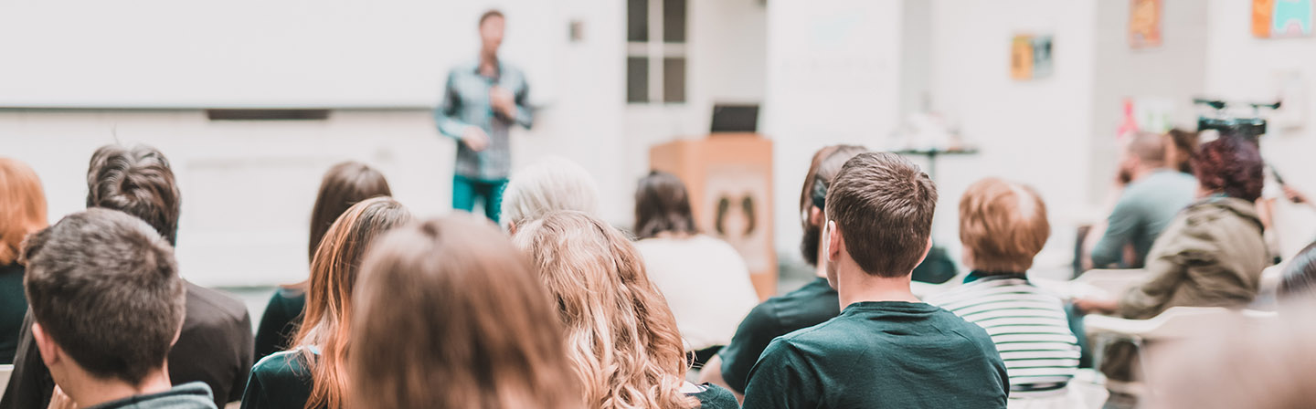 Man giving presentation in a lecture hall